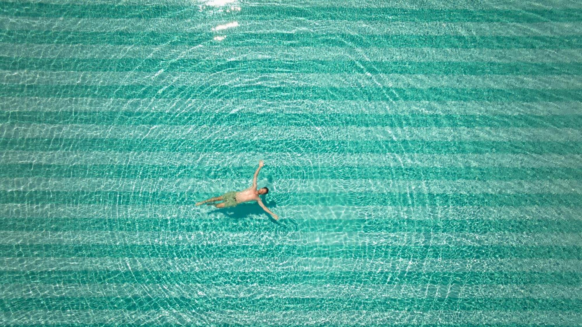 Secrets Sunny Beach Resort & Spa (Adults Only) Exterior photo A man floating in the Dead Sea